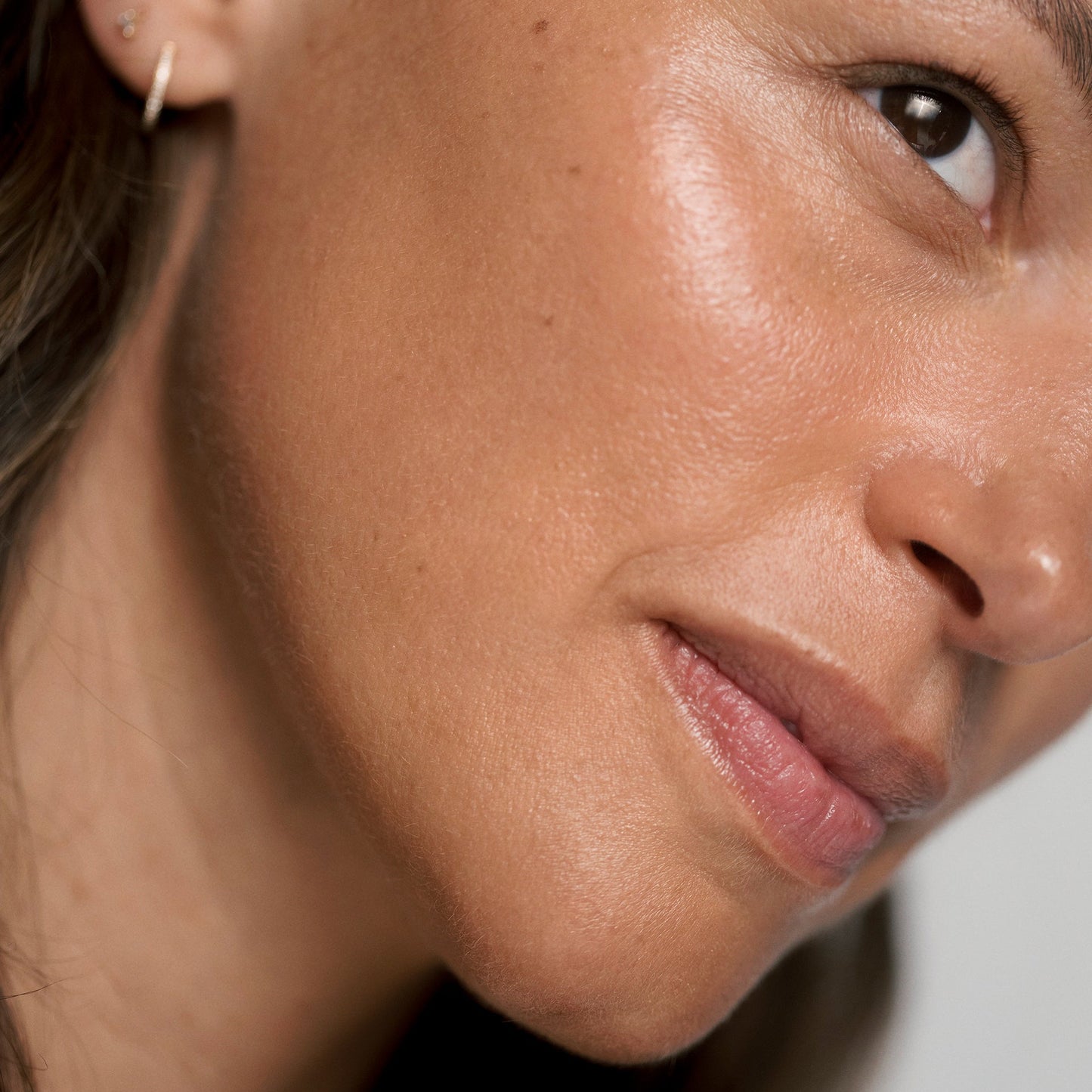 Close-up of a woman's face with a neutral expression